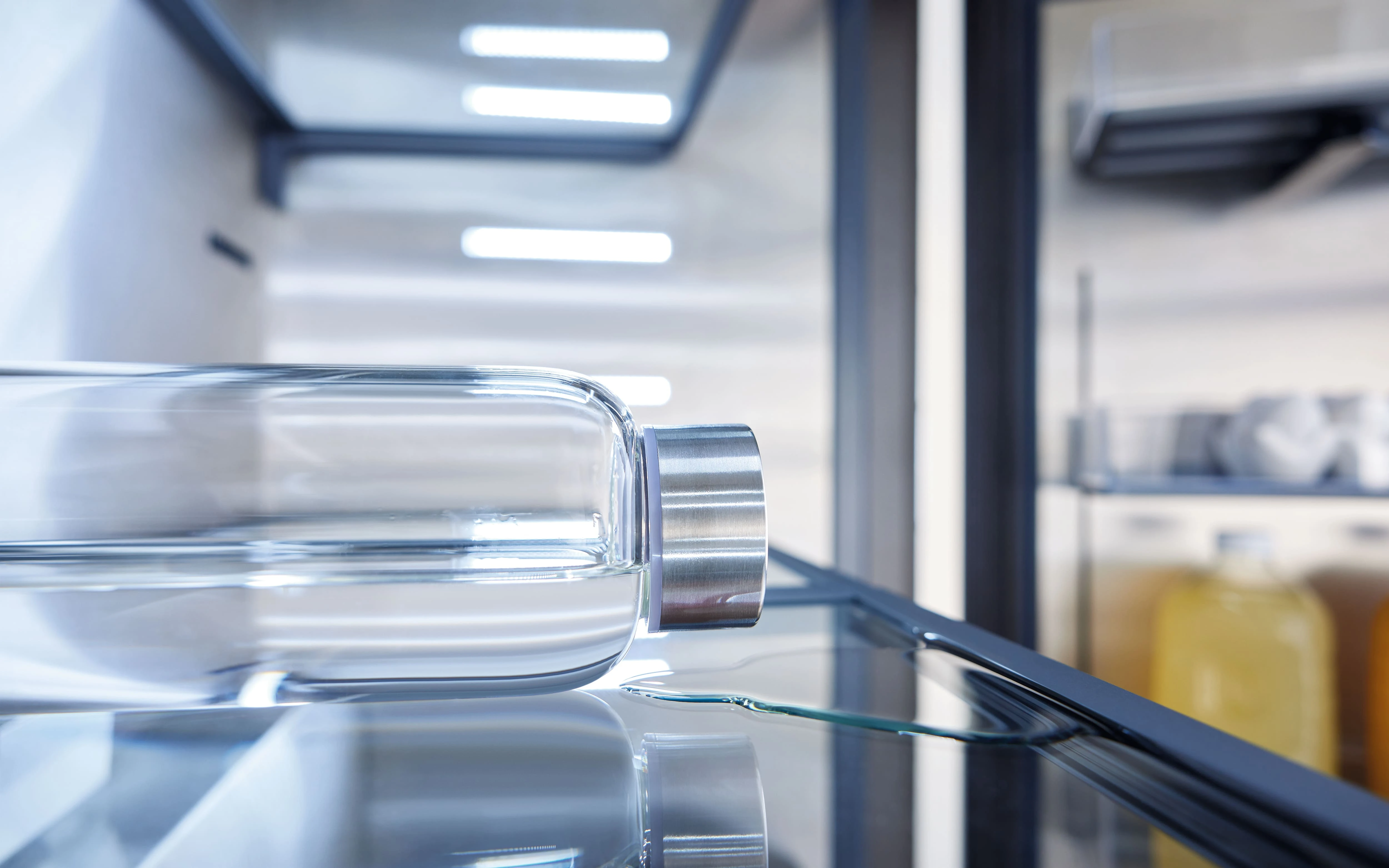 Spill-proof glass shelves