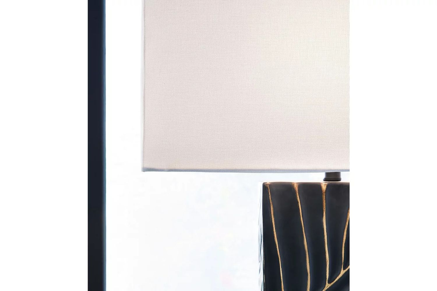 Bartlen Table Lamp In Black and Gold L235774