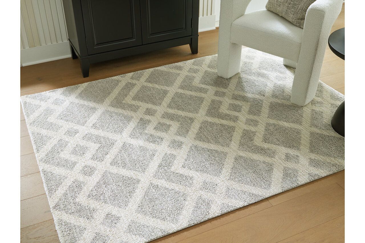 Unawick Medium Rug In Gray and Ivory R407332