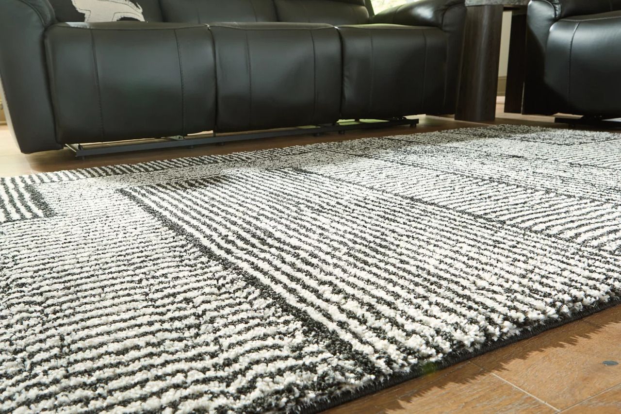 Kurtmen 7'10" x 9'10" Area Rug In Black and Ivory R407591