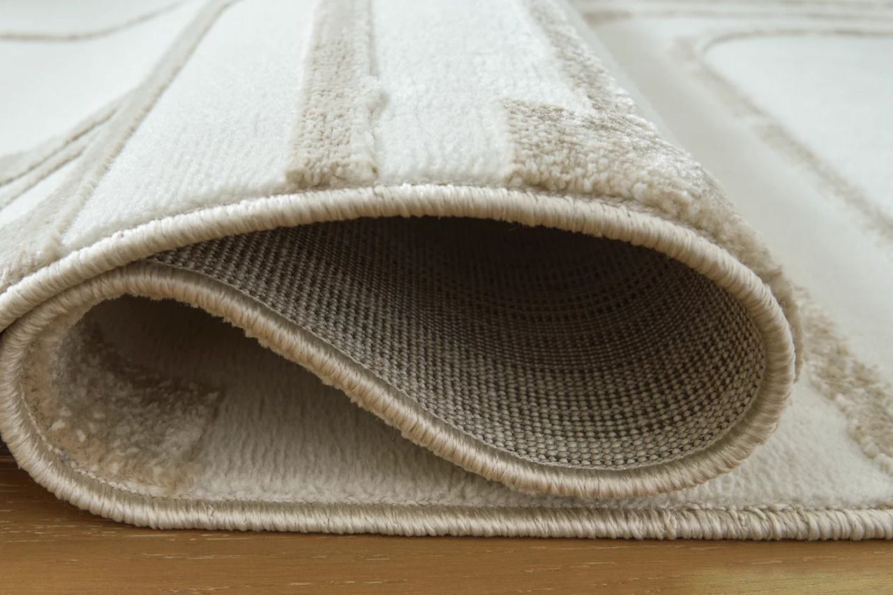 Farongrove 5'3" x 7' Area Rug In Ivory and Beige R407672