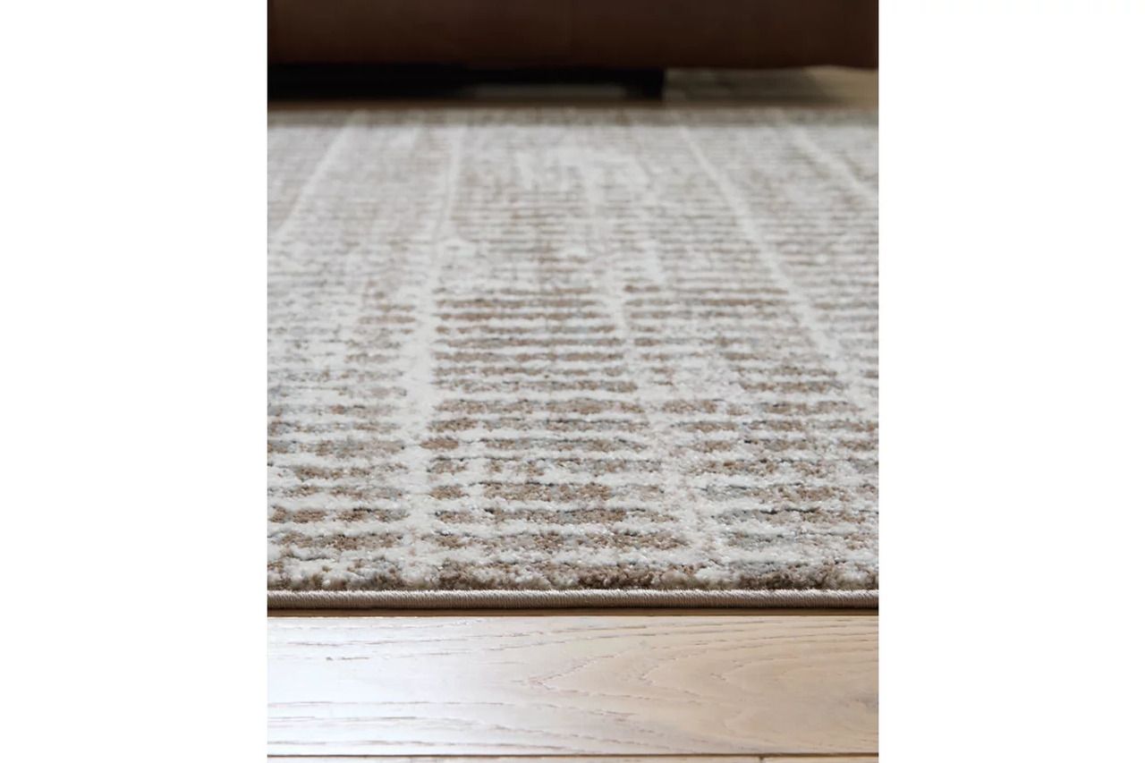 Fuadwick 5'3" x 7' Area Rug In Multi R407692