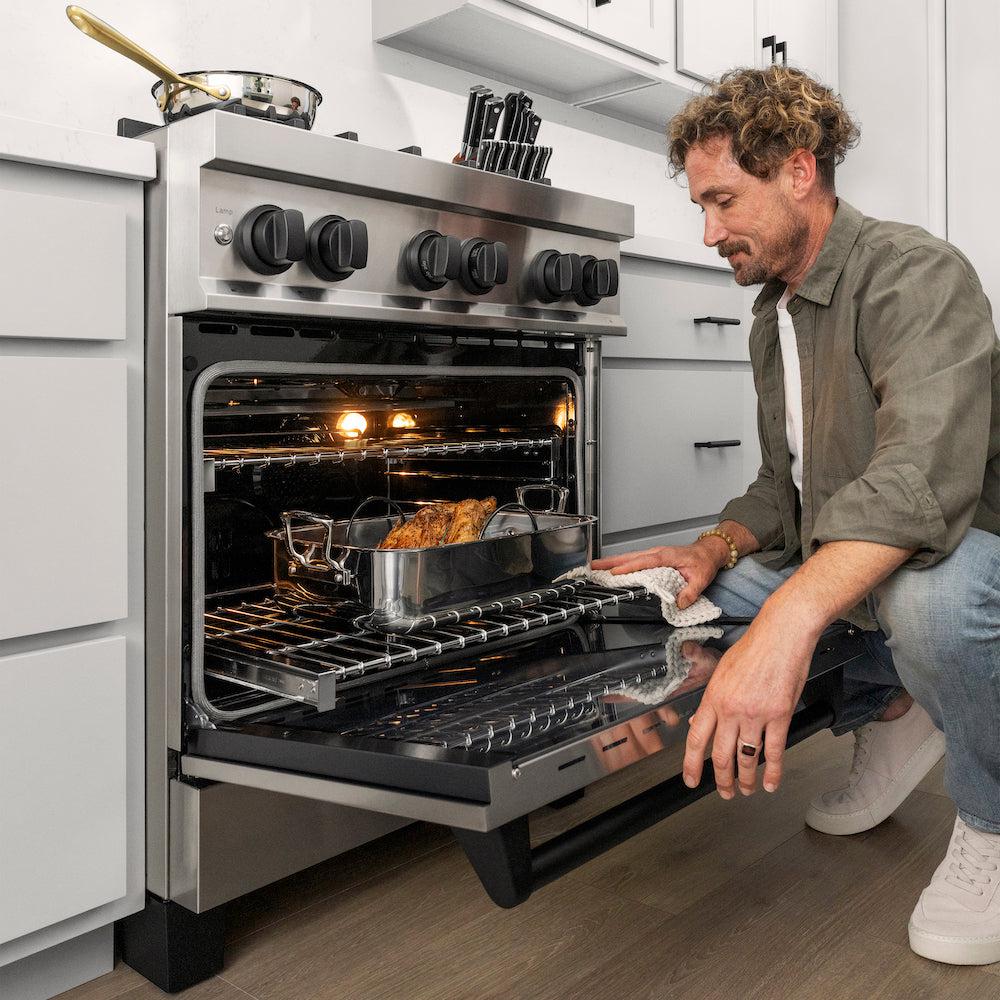 Autograph Edition 30 In. 4.0 Cu. Ft. Legacy Dual Fuel Range With 4 Burner Gas Cooktop And Electric Convection Oven In Stainless Steel And Matte Black Accents RAZ30MB