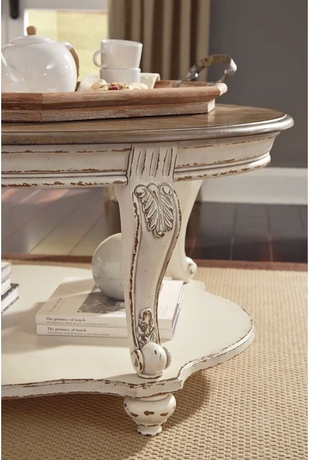 Realyn White and Brown Oval Cocktail Table T7430