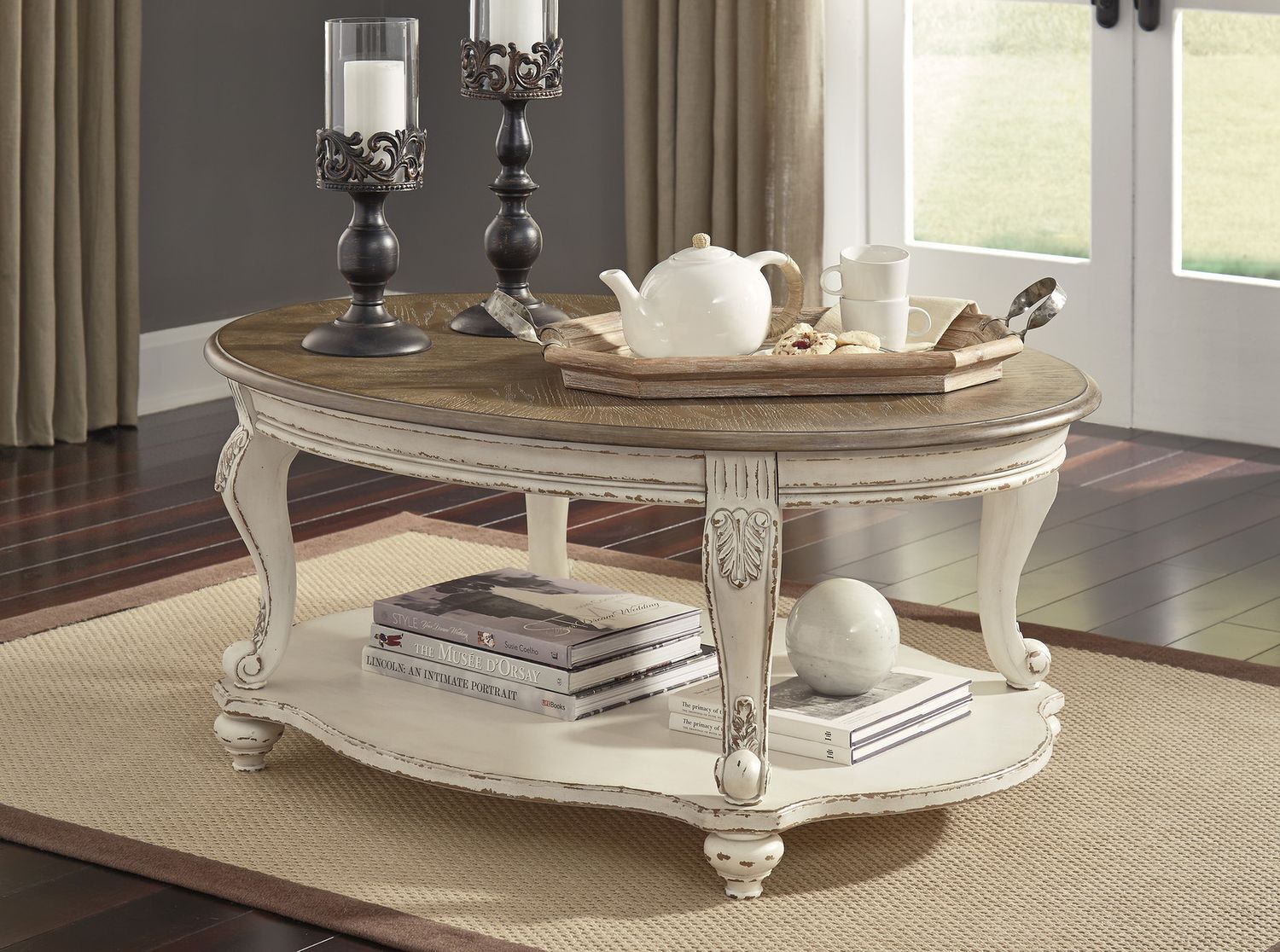 Realyn White and Brown Oval Cocktail Table T7430